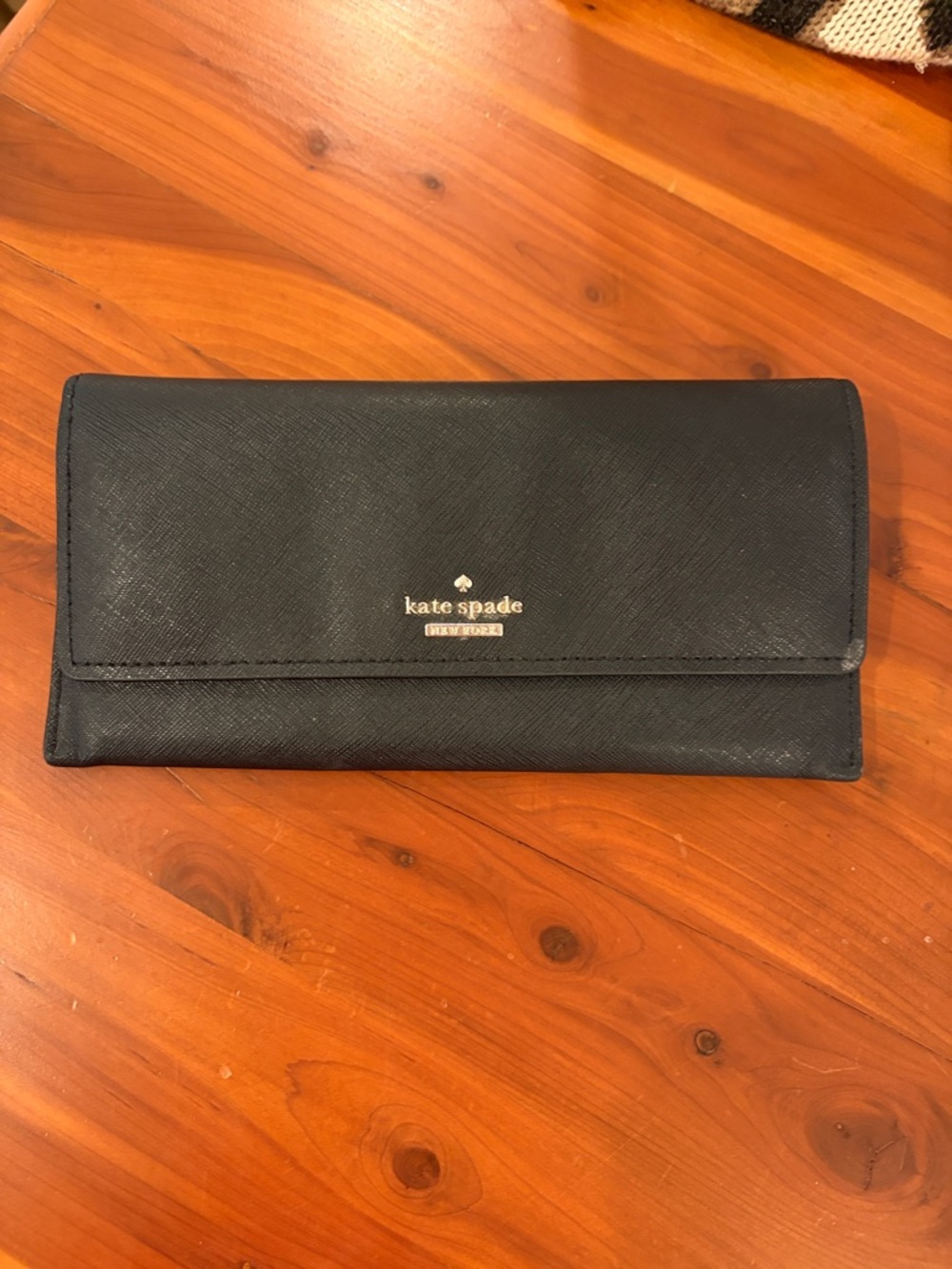 kate spade black saffiano leather continental wallet with gold logo